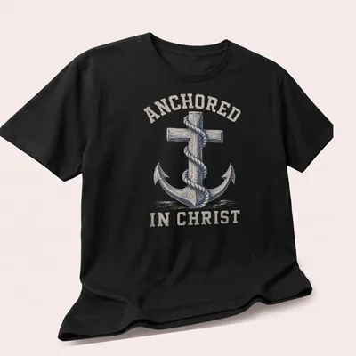 Vintage distressed Anchor In Christ t-shirt with anchor and cross design — printed on a unisex t-shirt (angled view)