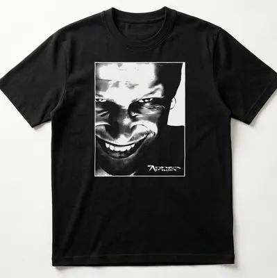 Black and white abstract graphic of Aphex Twin face with printed text. — printed on a unisex t-shirt