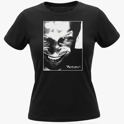Black and white abstract graphic of Aphex Twin face with printed text. — printed on a women's shirt