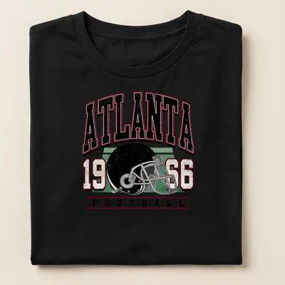 Vintage retro Atlanta Football t-shirt featuring a helmet and bold text — printed on a women's shirt