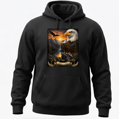 Realistic bald eagle soaring with tribute text for Jackie, featuring gold and brown tones. — printed on a unisex hoodie