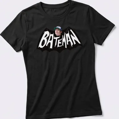 Bold Bateman text in black and white on a graphic — printed on a women's shirt