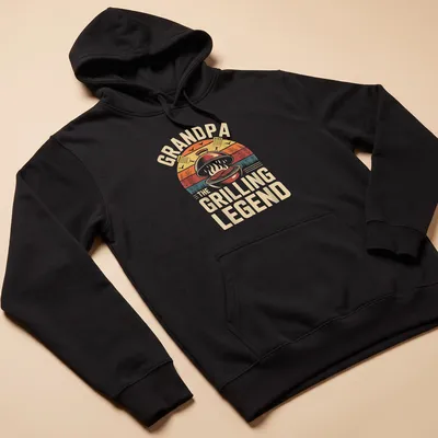 Vintage BBQ Grill Grandpa t-shirt with humorous text and grill illustration — printed on a unisex hoodie