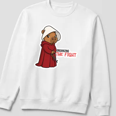 Kawaii bear in a red cloak with the phrase 'ORGANIZING THE FIGHT' printed above. — printed on a unisex sweatshirt