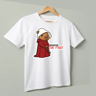 Kawaii bear in a red cloak with the phrase 'ORGANIZING THE FIGHT' printed above. — printed on a unisex t-shirt (angled view)