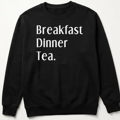 Bold typography t-shirt featuring Northerners' meal times: Breakfast, Dinner, Tea. — printed on a unisex sweatshirt