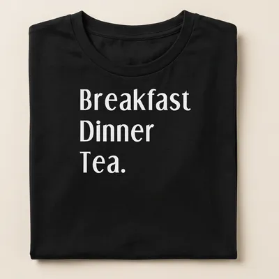 Bold typography t-shirt featuring Northerners' meal times: Breakfast, Dinner, Tea. — printed on a women's shirt