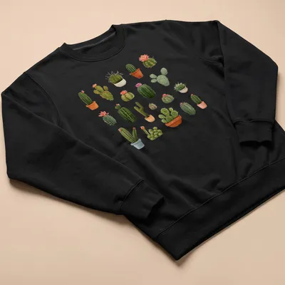 Watercolor print of cacti and succulents with text 'Prickles & Petals' — printed on a unisex sweatshirt