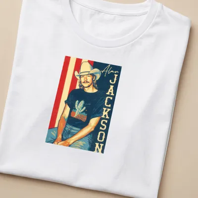 Retro fan t-shirt featuring Alan Jackson text with a cactus graphic in vibrant colors — printed on a women's shirt