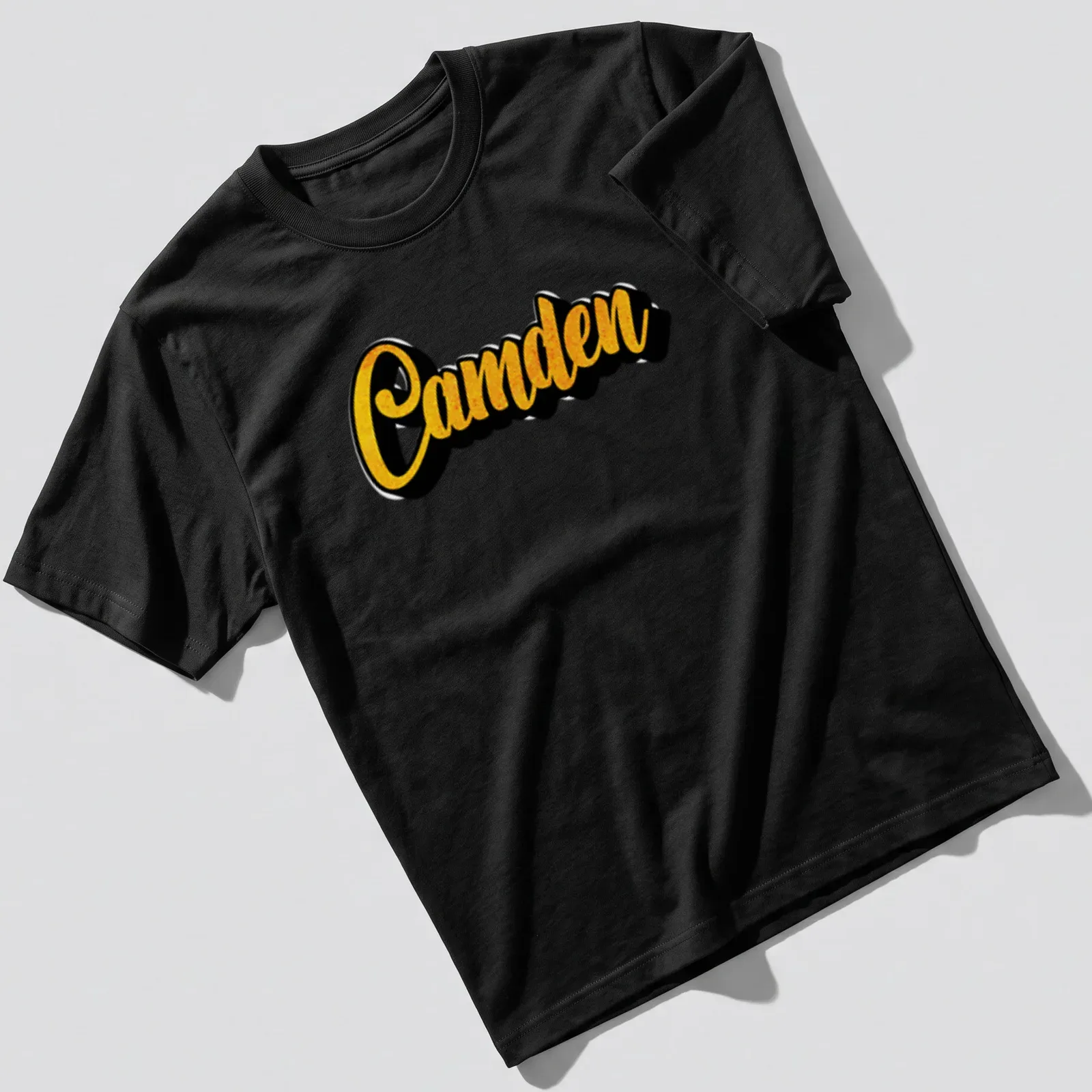 Bold yellow printed name 'Camden' on a black custom — printed on a unisex t-shirt
