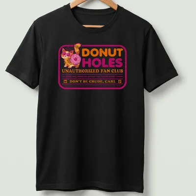 Colorful cartoon graphic of a cat with sunglasses and donut on a humorous t-shirt