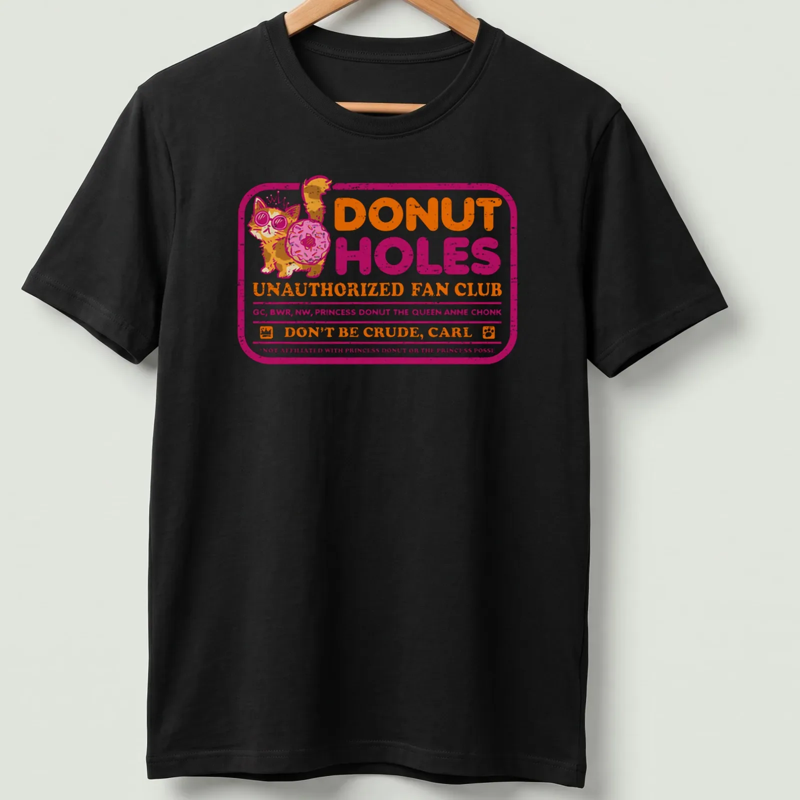 Colorful cartoon graphic of a cat with sunglasses and donut on a humorous — printed on a unisex t-shirt