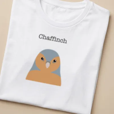 Minimalist illustration of a chaffinch in gray and orange against a white background — printed on a women's shirt