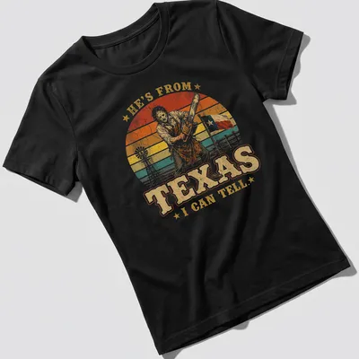 Vintage retro T-shirt featuring a chainsaw killer with bold text above — printed on a women's shirt