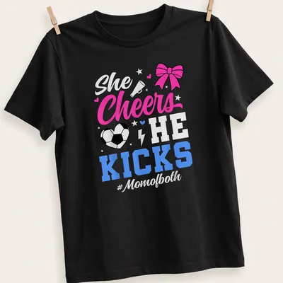 Colorful shirt with text 'She Cheers He Kicks #Momofboth' and graphics of pom-poms and a soccer ball