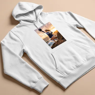 Realistic photograph of a cheerleader with 'WILDCATS' text on a sunlit coast — printed on a unisex hoodie