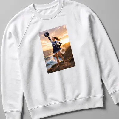 Realistic photograph of a cheerleader with 'WILDCATS' text on a sunlit coast — printed on a unisex sweatshirt