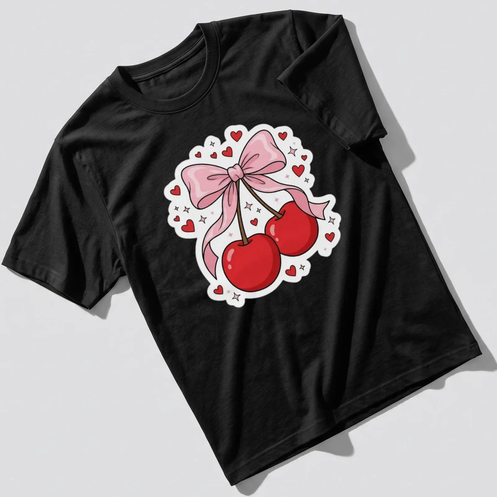 Kawaii cartoon T-shirt with cherries, pink ribbon, and heart accents — printed on a unisex t-shirt