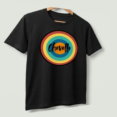 Retro circular Chevelle t-shirt in multi-colored print — printed on a unisex t-shirt (angled view)