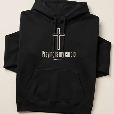 Minimalist design featuring a Christian cross and text about prayer as cardio — printed on a unisex hoodie