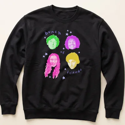 Colorful pop art design featuring an array of friends' faces with playful expressions. — printed on a unisex sweatshirt