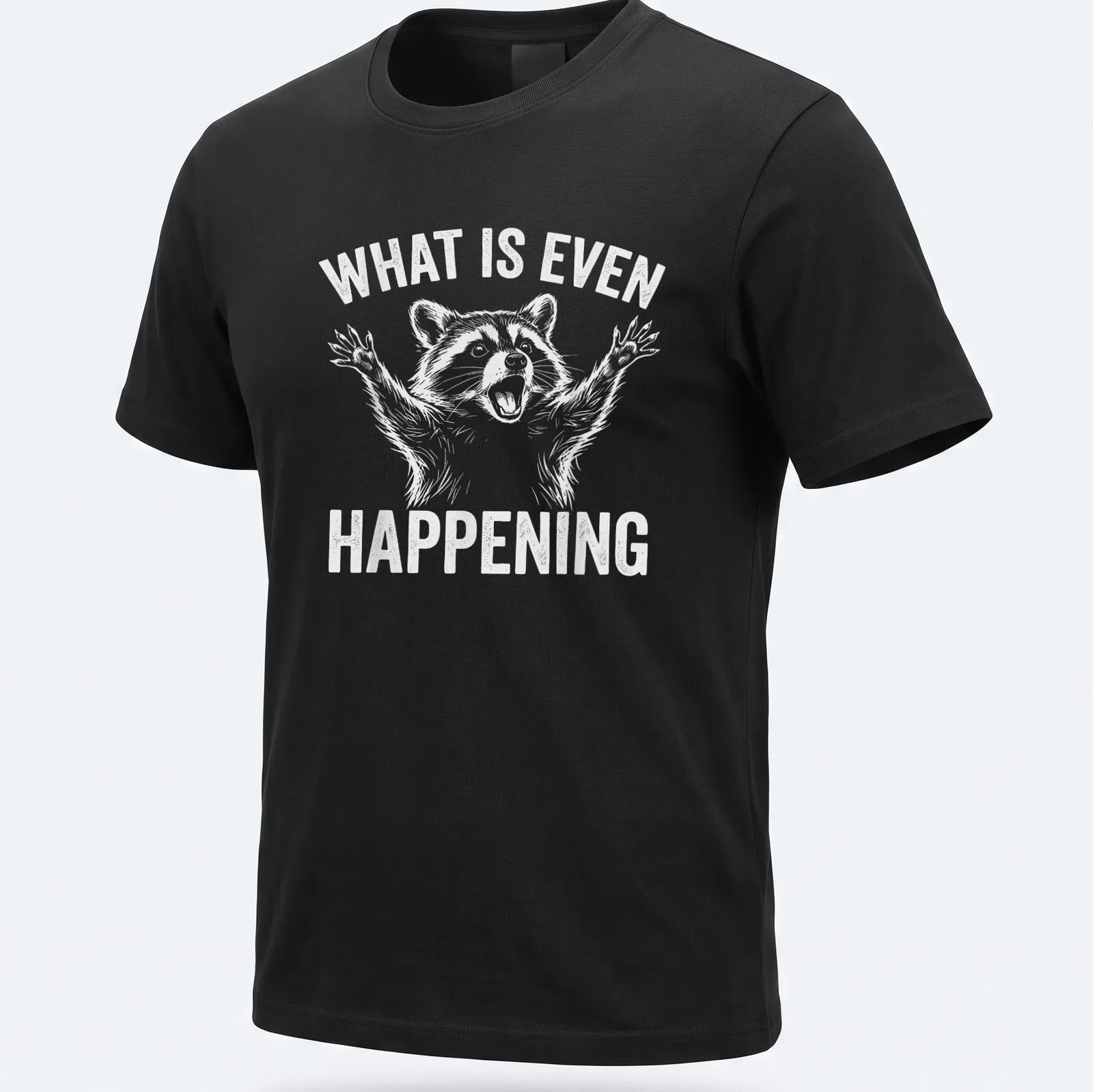 Cartoon raccoon with wide eyes and text 'WHAT IS EVEN HAPPENING' — printed on a unisex t-shirt