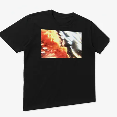 Abstract coral bloom graphic in orange, black, and white colors — printed on a unisex t-shirt (angled view)