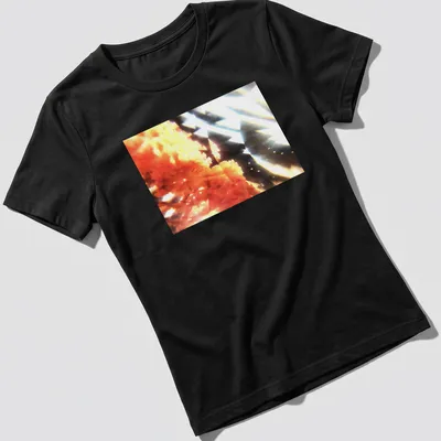Abstract coral bloom graphic in orange, black, and white colors — printed on a women's shirt