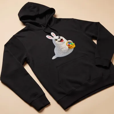 Cartoon Crabeater seal holding a colorful Easter basket with eggs. — printed on a unisex hoodie