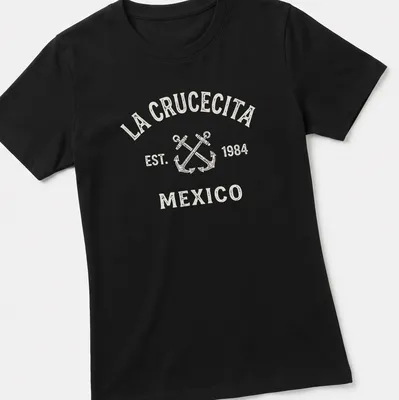 Vintage print of crossed boat anchors with La Crucecita Mexico text — printed on a women's shirt