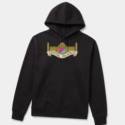 Bold graphic Crystal Palace F.C. crest logo in gold, pink, light blue, and white — printed on a unisex hoodie