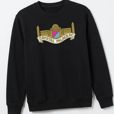 Bold graphic Crystal Palace F.C. crest logo in gold, pink, light blue, and white — printed on a unisex sweatshirt