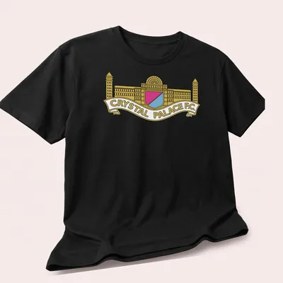 Bold graphic Crystal Palace F.C. crest logo in gold, pink, light blue, and white — printed on a unisex t-shirt (angled view)