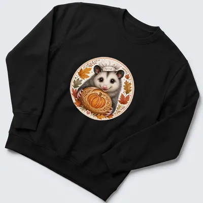 Whimsical illustration of a cute possum baker holding a pumpkin-shaped sourdough — printed on a unisex sweatshirt