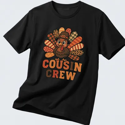 Cartoon turkey design with 'Cousin Crew' text, bright colors for Thanksgiving. — printed on a unisex t-shirt