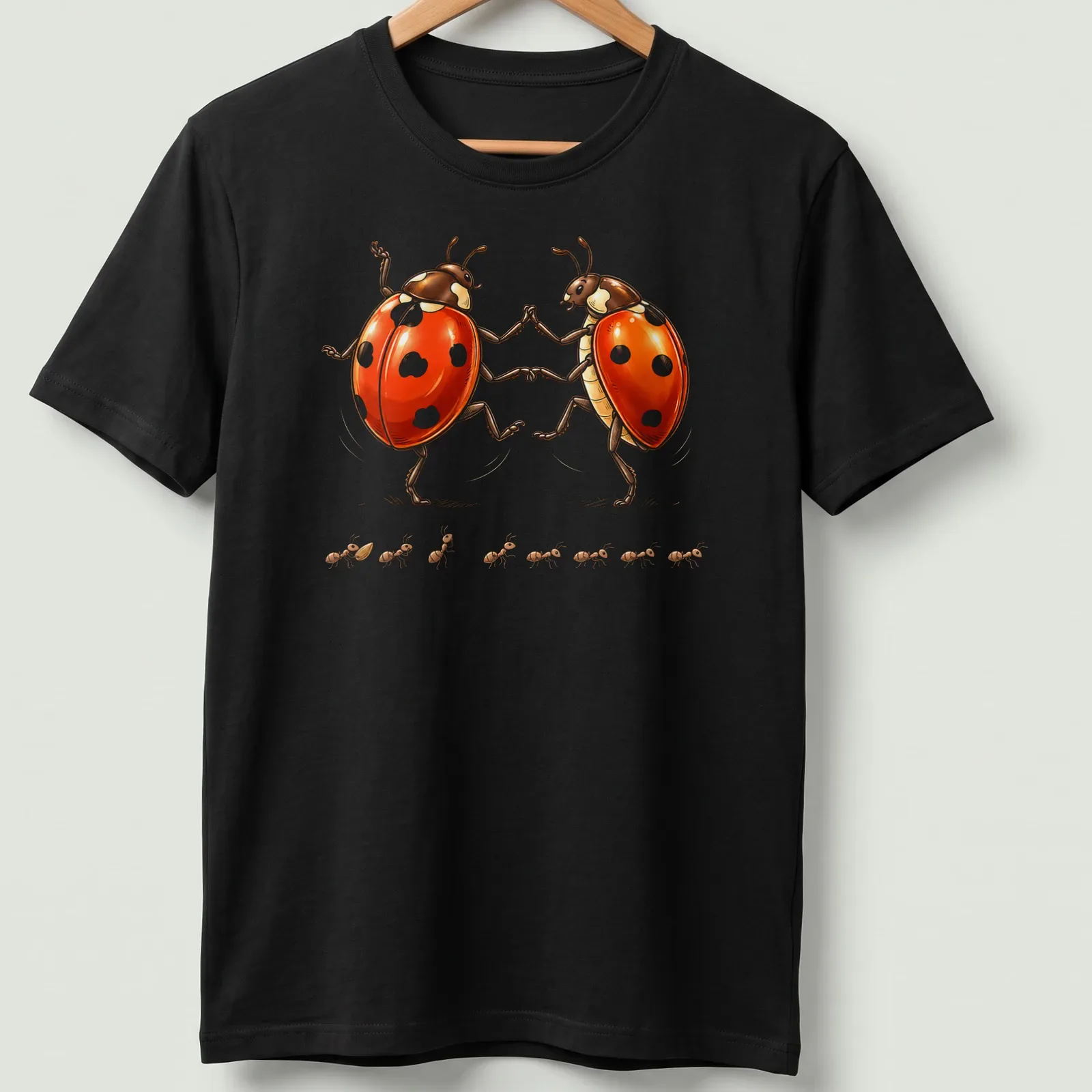 Whimsical illustration of dancing ladybugs in red, black, and white — printed on a unisex t-shirt