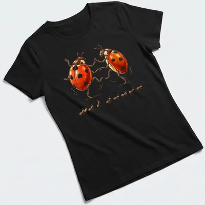 Whimsical illustration of dancing ladybugs in red, black, and white — printed on a women's shirt