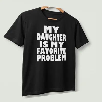 Bold typography t-shirt with the phrase 'MY DAUGHTER IS MY FAVORITE PROBLEM' in white. — printed on a unisex t-shirt (angled view)
