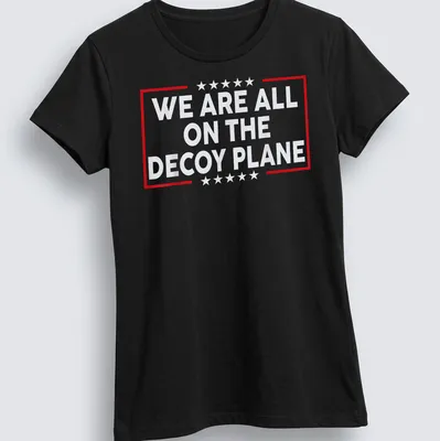 Bold typography t-shirt with the phrase 'We Are All On The Decoy Plane' — printed on a women's shirt