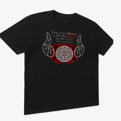 Bold graphic tee featuring a devil and hands with a famous quote about dancing in the moonlight. — printed on a unisex t-shirt (angled view)