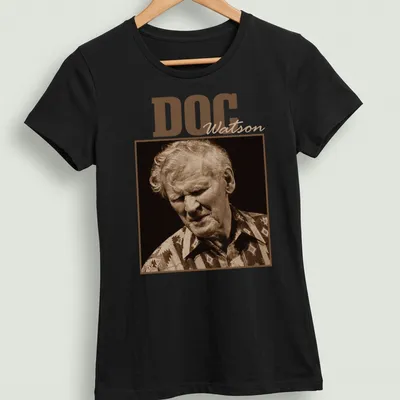 Vintage-style Doc Watson t-shirt with sepia-toned printed text — printed on a women's shirt