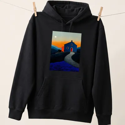 Dreamy landscape t-shirt with a blue house at sunset, featuring orange and lavender hues — printed on a unisex hoodie