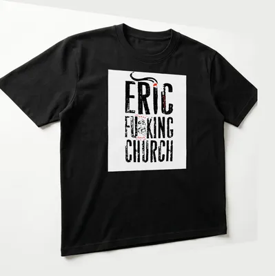 Bold typography Eric Church T-shirt with distressed lettering in black, red, and white — printed on a unisex t-shirt (angled view)