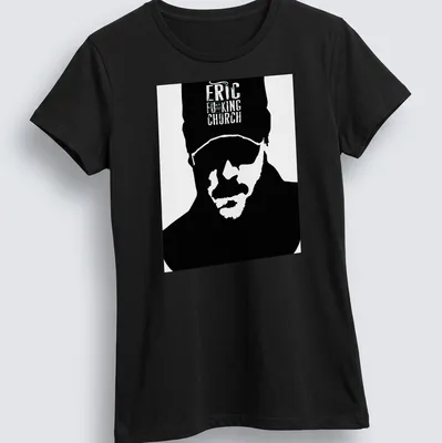 Bold graphic of Eric Church's silhouette with vibrant text in black, white, green, and blue. — printed on a women's shirt