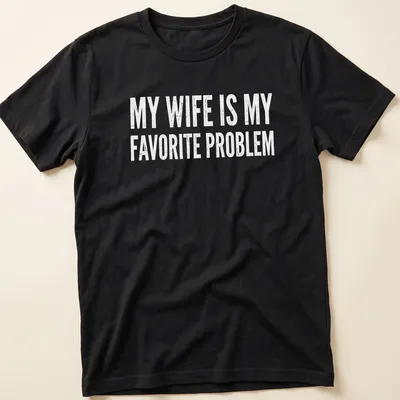 Distressed humorous slogan on a black tee: My Wife Is My Favorite Problem