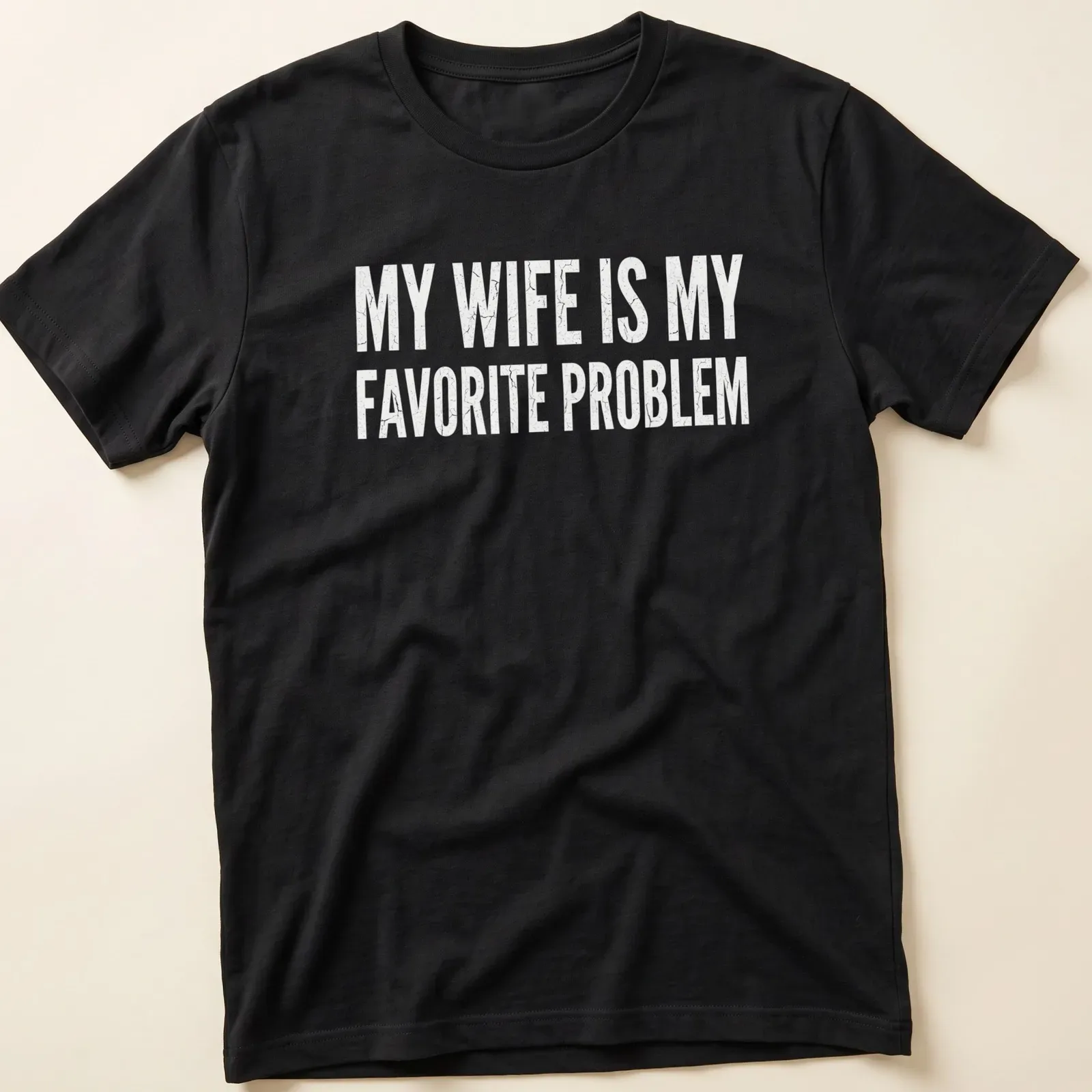 Distressed humorous slogan on a black tee: My Wife Is My Favorite Problem — printed on a unisex t-shirt