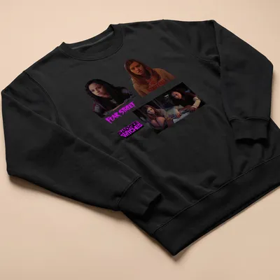 Graphic of Fear Street characters with the text 'Fear Street Shadyside Witches' in purple, black, brown, and cream. — printed on a unisex sweatshirt