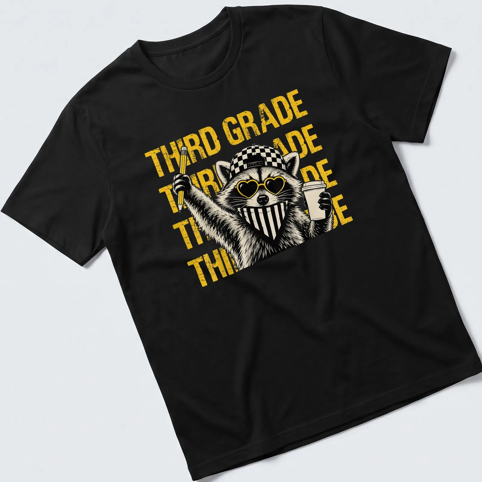 Bold raccoon graphic wearing glasses with 'THIRD GRADE' text — printed on a unisex t-shirt