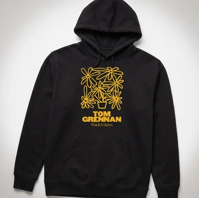 Line art illustration of a flower pot with flowers and text 'TOM GRENNAN What Is & Maybes' — printed on a unisex hoodie