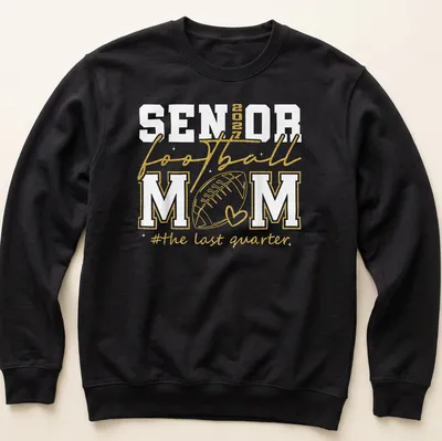 Glittery shirt featuring text celebrating a senior football mom in gold and white. — printed on a unisex sweatshirt